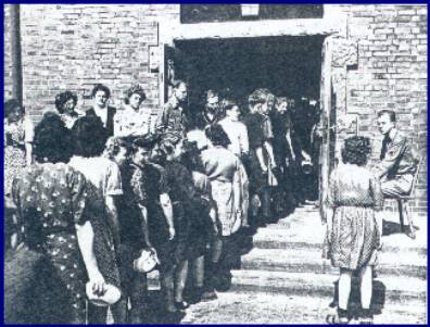 Survivors of Salwedel line up with bowls; photo courtesy of Vernon Tott